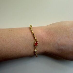 Kendra Scott Grayson Stretch Bracelet in a red illusion or red magnesite color